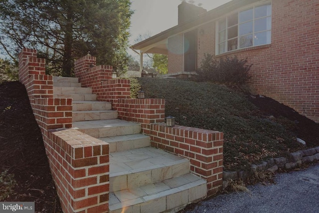 exterior details with brick siding and stairs