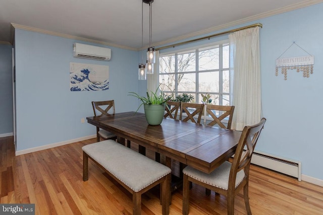 dining area featuring baseboard heating, an AC wall unit, ornamental molding, and light wood finished floors