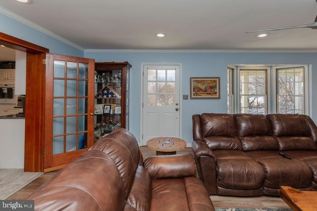 living room featuring recessed lighting, wood finished floors, and ornamental molding