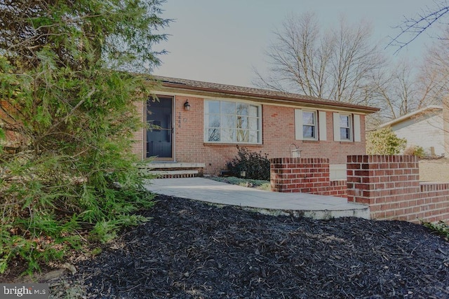 view of front of house with brick siding