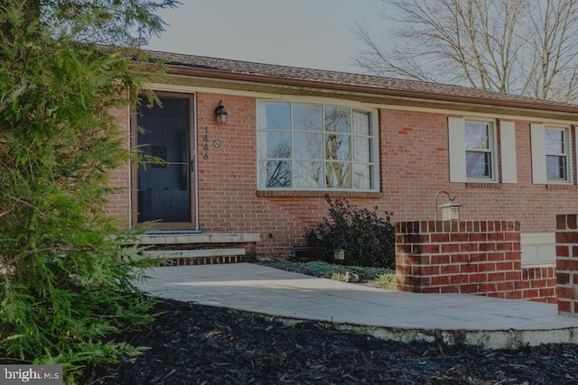 entrance to property with brick siding