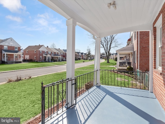 view of patio / terrace with covered porch and a residential view