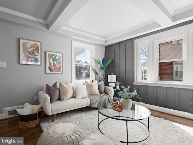 living area featuring wood finished floors, visible vents, and ornamental molding