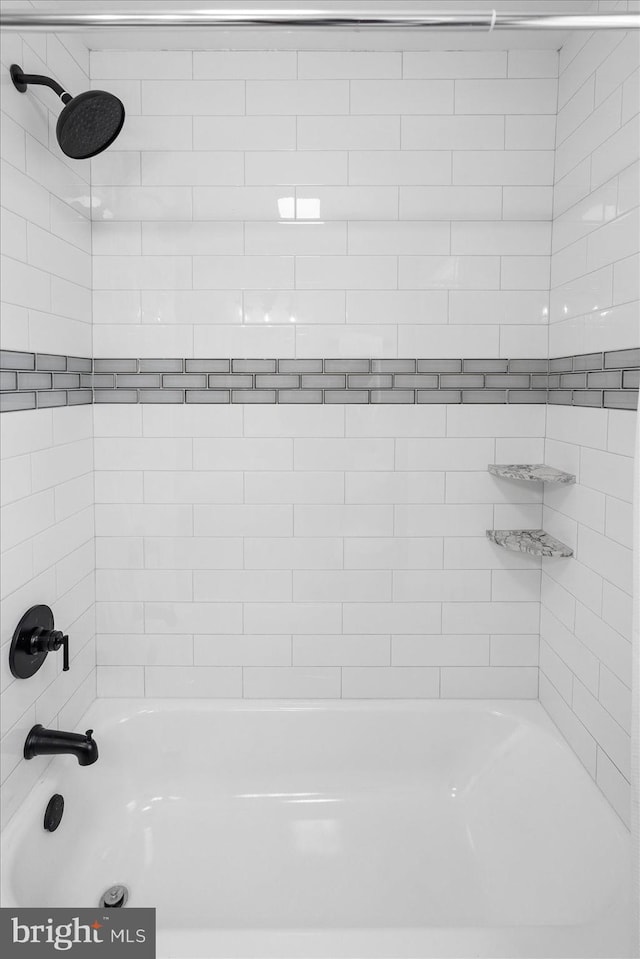 bathroom featuring  shower combination