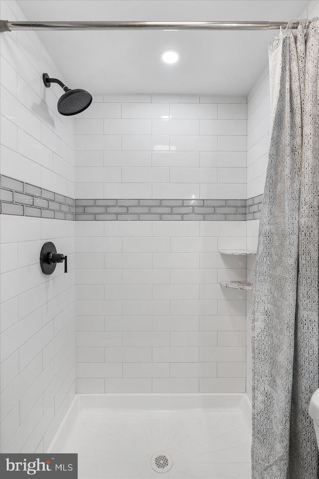 bathroom with a stall shower