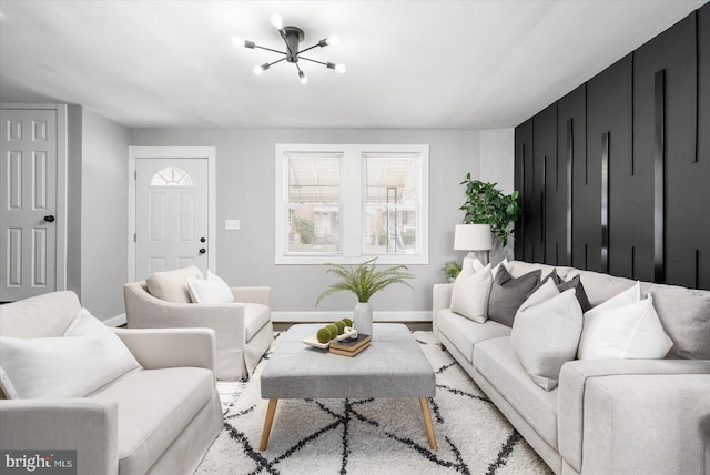 living area featuring light wood-type flooring and baseboards