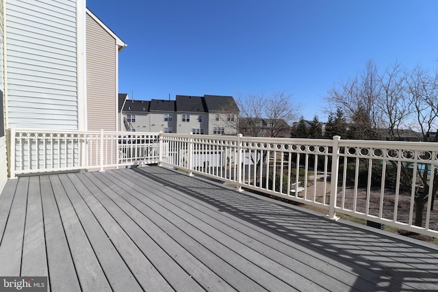 wooden terrace with a residential view