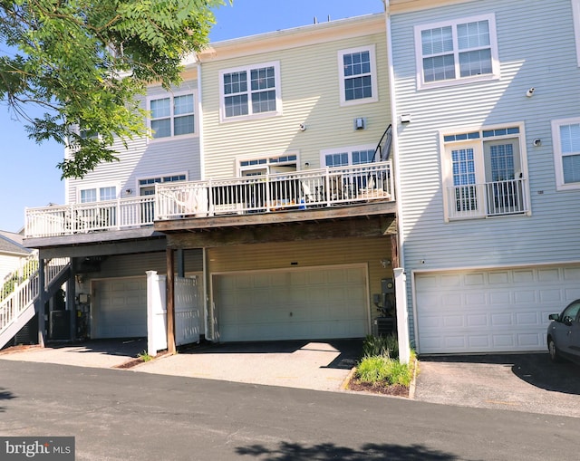 rear view of house with an attached garage