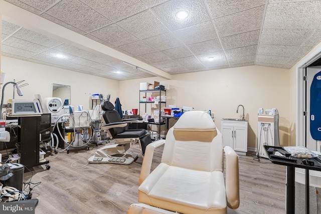 interior space featuring recessed lighting, a paneled ceiling, and wood finished floors