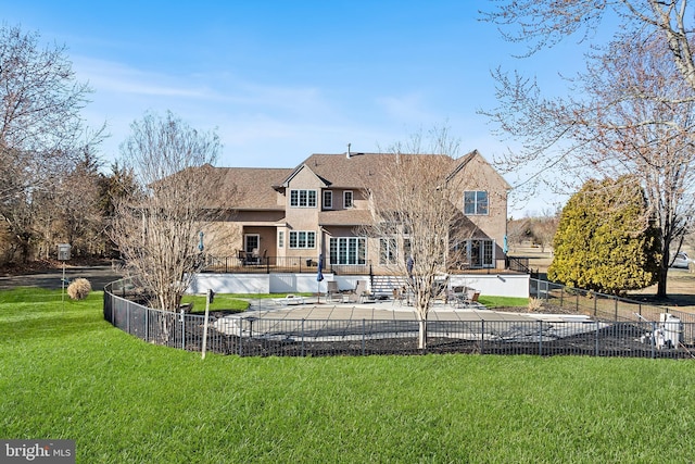 rear view of property featuring a yard, a patio, fence private yard, and stucco siding