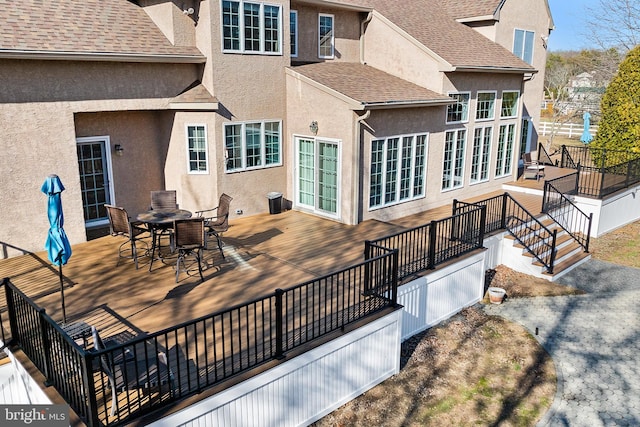 wooden deck featuring outdoor dining space