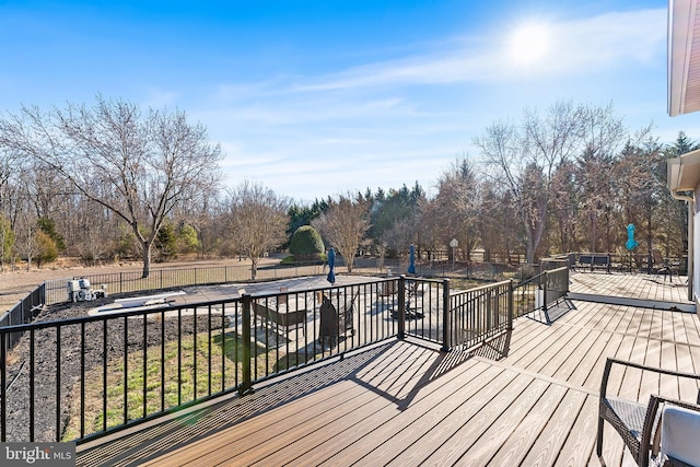 deck featuring a patio area and a fenced backyard