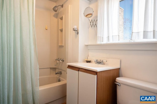 full bathroom with vanity, toilet, and shower / bath combo with shower curtain