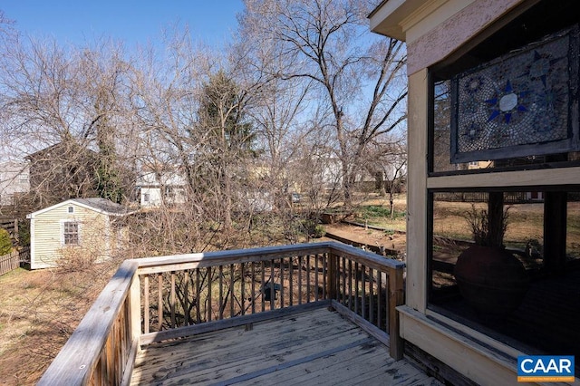 wooden deck with an outdoor structure