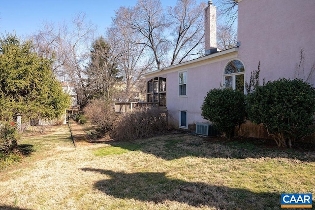 view of yard featuring central AC unit