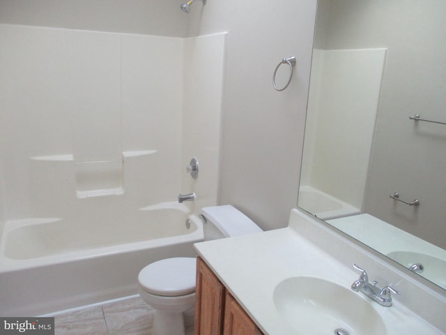 bathroom featuring toilet, shower / tub combination, and vanity