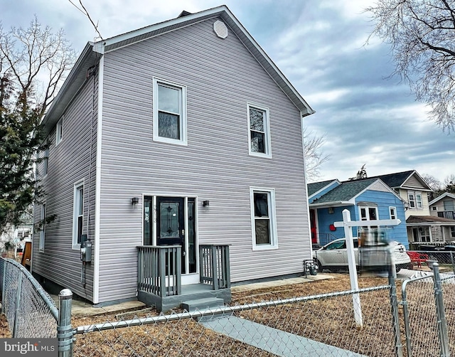 view of front of home featuring a gate and fence