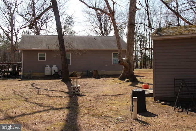 view of home's exterior featuring roof with shingles