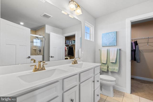 full bathroom with a stall shower, visible vents, a sink, and tile patterned floors