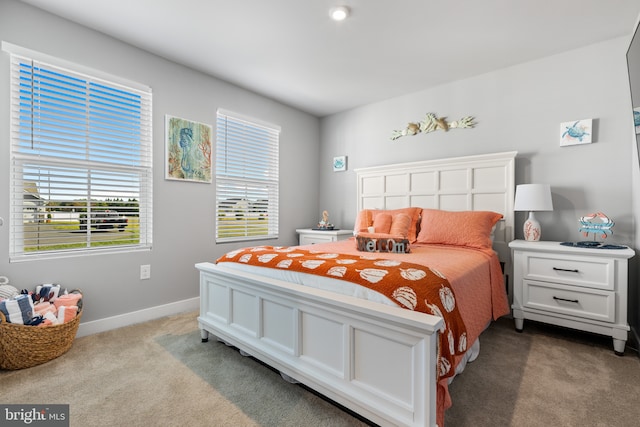 bedroom featuring carpet flooring and baseboards