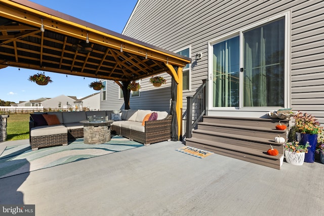 view of patio / terrace featuring entry steps, a gazebo, and outdoor lounge area