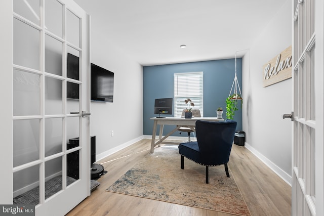 office space featuring wood finished floors and baseboards