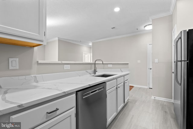 kitchen with visible vents, light stone counters, ornamental molding, stainless steel appliances, and a sink