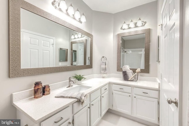 full bath with walk in shower and vanity