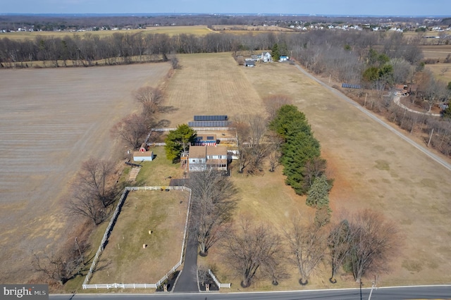 birds eye view of property with a rural view