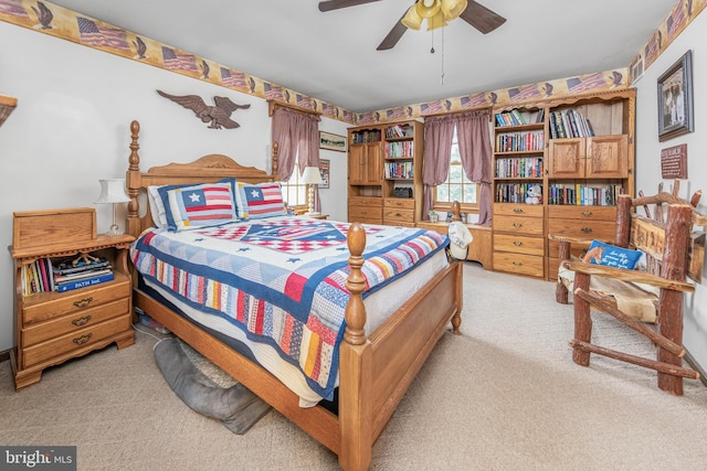 bedroom featuring ceiling fan and light carpet