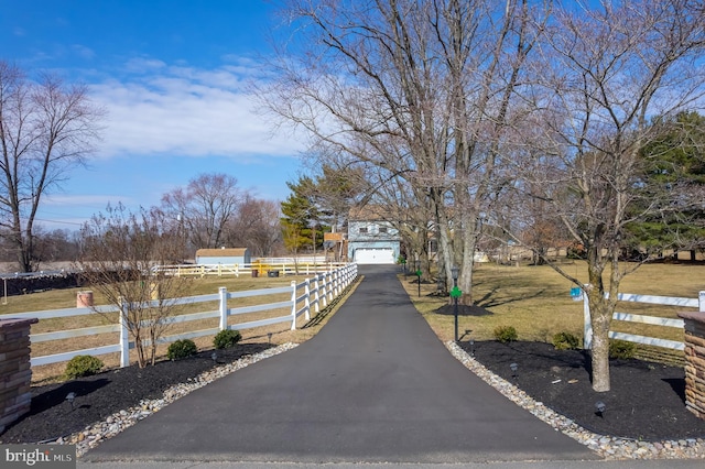 view of road featuring aphalt driveway