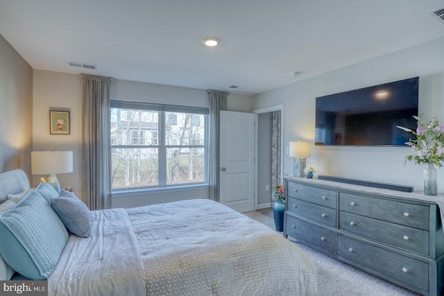 bedroom with carpet floors and visible vents