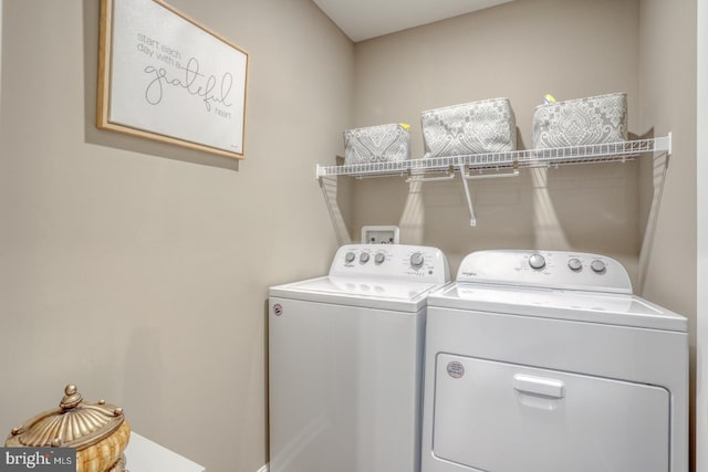 laundry area featuring laundry area and washer and clothes dryer