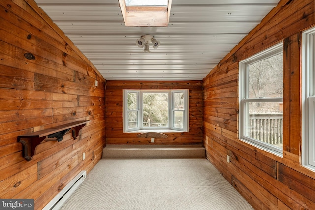 unfurnished sunroom featuring lofted ceiling, wood ceiling, and a baseboard radiator