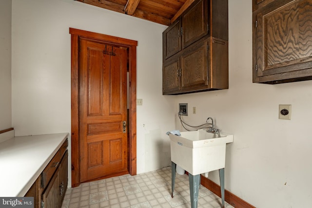 clothes washing area with washer hookup, wood ceiling, cabinet space, light floors, and electric dryer hookup