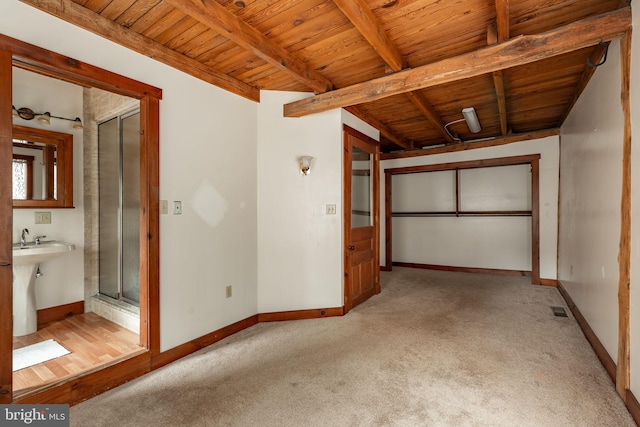 unfurnished bedroom with light carpet, wooden ceiling, visible vents, and baseboards