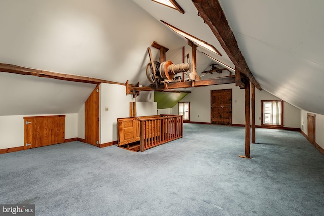 bonus room with vaulted ceiling with beams, carpet, and baseboards