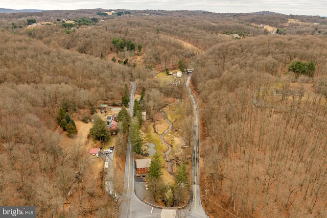 drone / aerial view with a view of trees