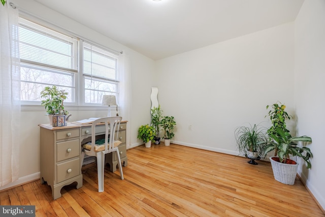 home office featuring light wood-style floors and baseboards