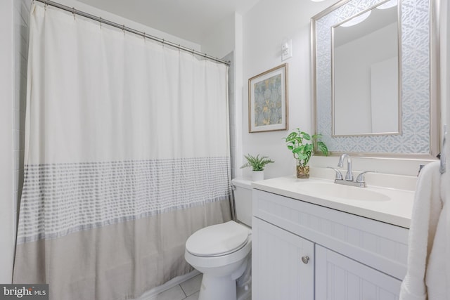 full bathroom with toilet, tile patterned flooring, and vanity