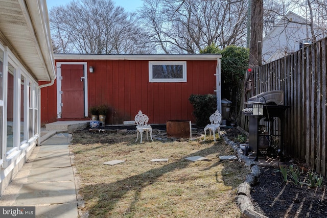 exterior space with fence and an outdoor structure