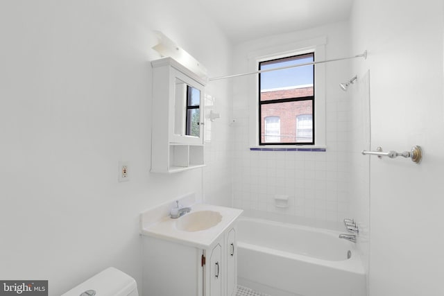 full bath featuring toilet, vanity, and shower / bathtub combination