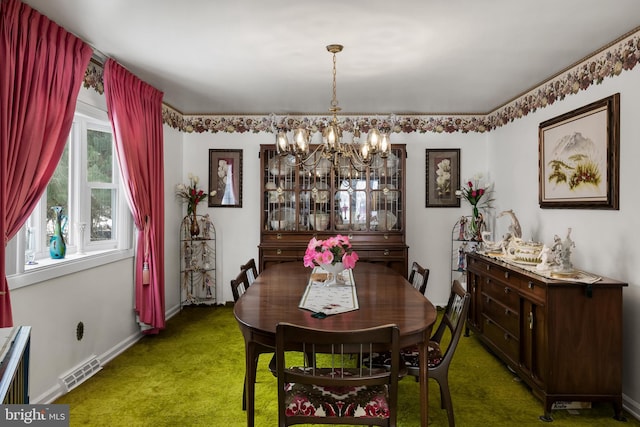 dining area with baseboards, carpet, visible vents, and a notable chandelier