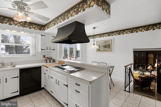 kitchen featuring black dishwasher, a wealth of natural light, a sink, island range hood, and a peninsula