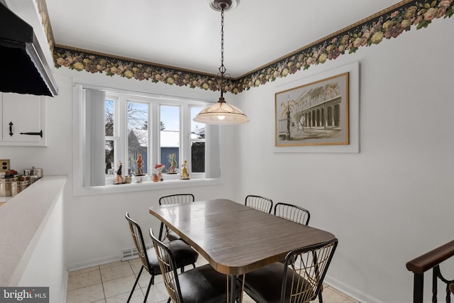 dining space featuring baseboards