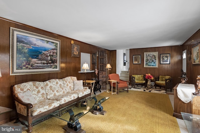 living room with wood walls and carpet flooring