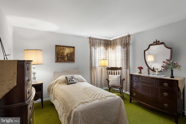 bedroom with baseboards and carpet flooring