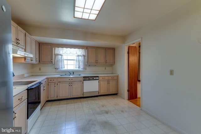 kitchen featuring light countertops, electric range, a sink, dishwasher, and under cabinet range hood