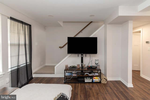 bedroom with baseboards and wood finished floors