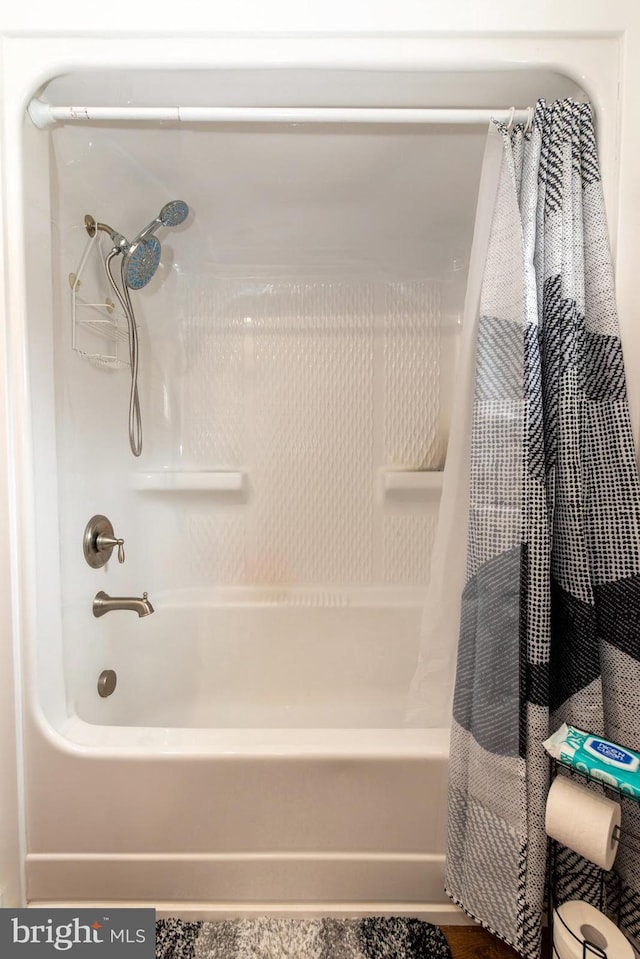 full bath featuring shower / bathtub combination with curtain